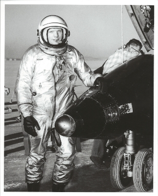Neil Armstrong standing at nose of X-15