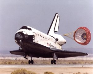 Space shuttle orbiter Discovery lands at Edwards AFB